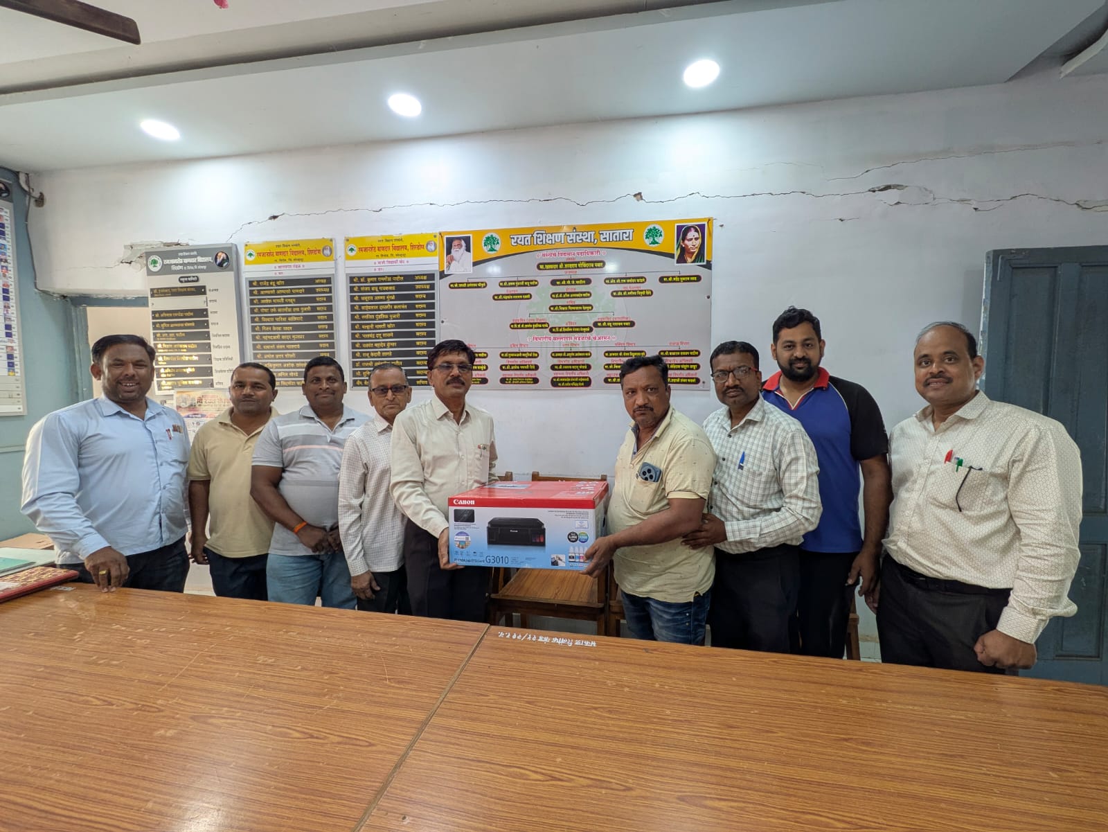 Prince Koik gifts printer to Bandar High School in Shirdhon